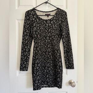 Material Girl Long Sleeve Bodycon Mini Dress
Size S Leopard Print Black Holiday